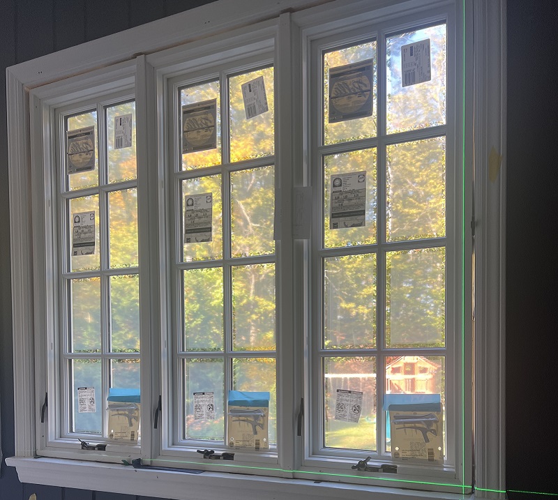 The laser level in use for this Greenwich window replacement